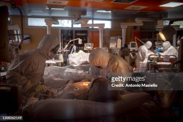 Doctors treat COVID-19 patients in an intensive care unit at the third Covid 3 Hospital during the Coronavirus emergency on March 26 in Rome, Italy....