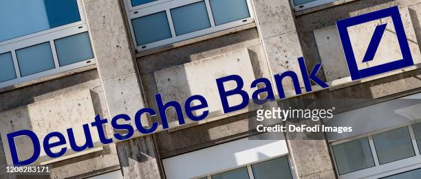 The logo of Deutsche Bank is seen on the facade of a Deutsche Bank branch on March 24, 2020 in Dortmund, Germany.
