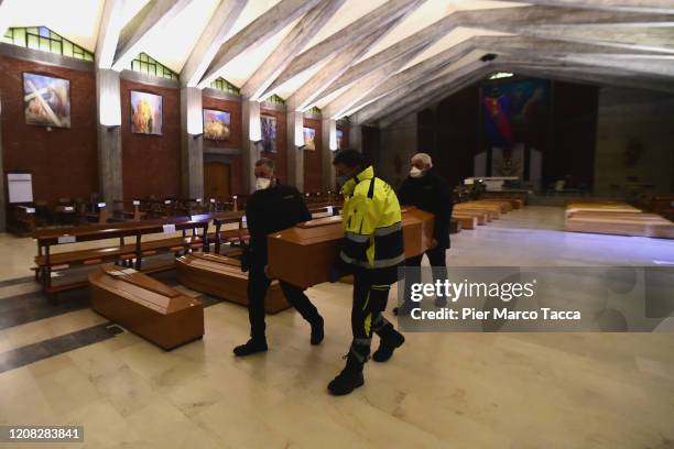 Coffins are lined up in the church of San Giuseppe, waiting to be taken to the crematorium on March 26, 2020 in Seriate, Italy. The Italian...