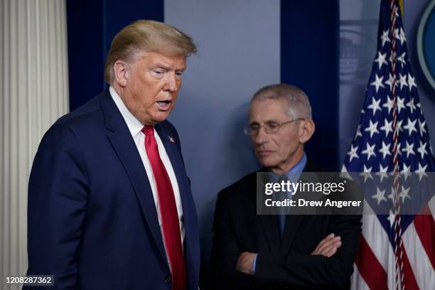 President Donald Trump and National Institute of Allergy and Infectious Diseases Director Anthony Fauci arrive for a briefing on the coronavirus...