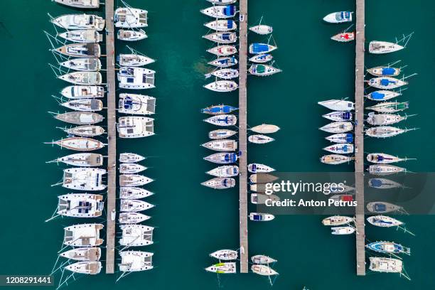 sailboats in the marina and the city of lefkada island, greece - lefkada city stock-fotos und bilder