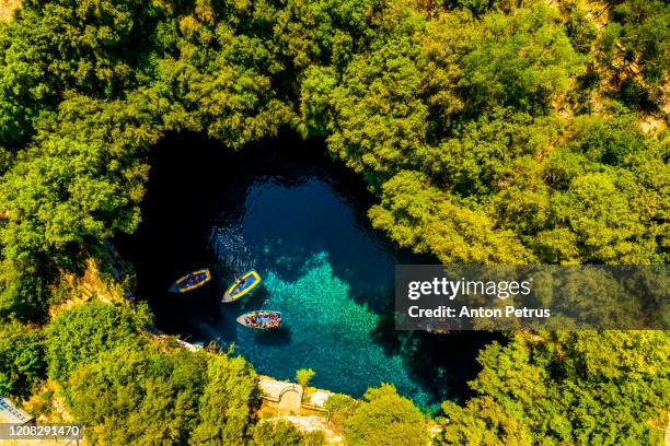 famous melissani lake on kefalonia island, greece. aerial view - kefalonia fotografías e imágenes de stock