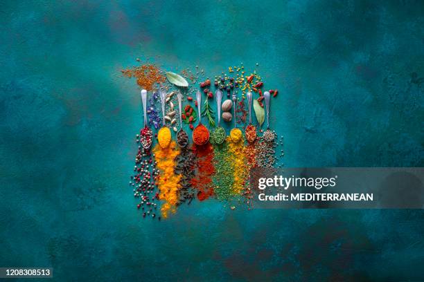 spices herbs seasoning condiments on vintage spoons - colour saffron stock pictures, royalty-free photos & images