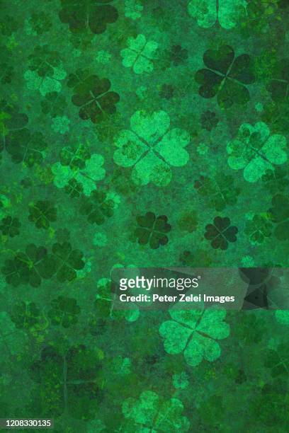 green clover background - four leaf clover stock pictures, royalty-free photos & images