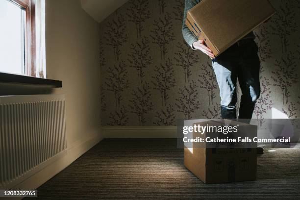 man lifting boxes - moving truck stock pictures, royalty-free photos & images