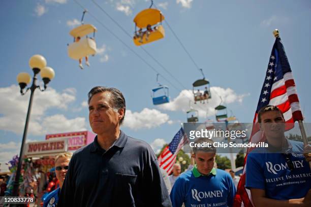 Republican presidential candidate Mitt Romney introduces himself to voters at the Iowa State Fair August 11, 2011 in Des Moines, Iowa. Romney was a...