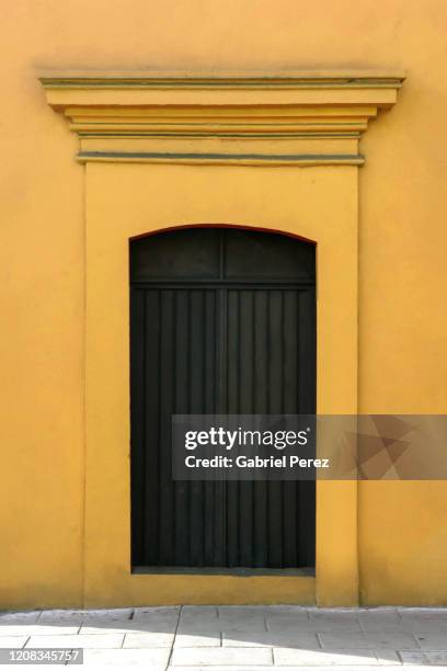 an architectural image of a spanish colonial door in oaxaca city - traditionally spanish stock pictures, royalty-free photos & images