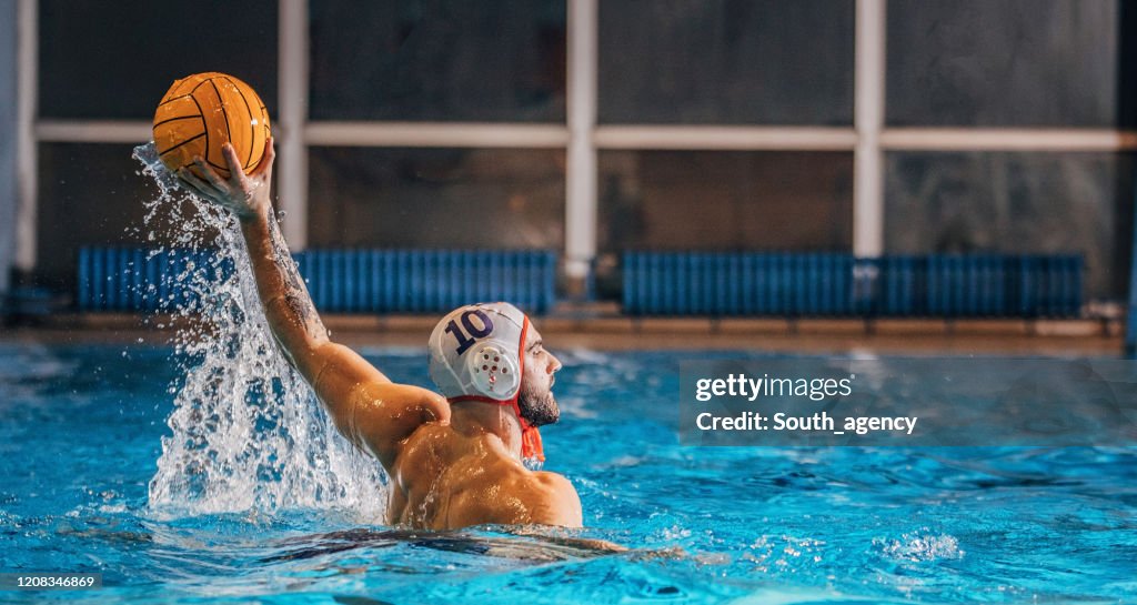 Young man playing water polo
