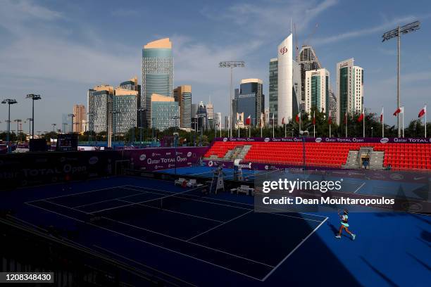 General view as Carla Suarez Navarro of Spain returns a forehand against Zhang Shuai of China during Day 2 of the WTA Qatar Total Open 2020 at...