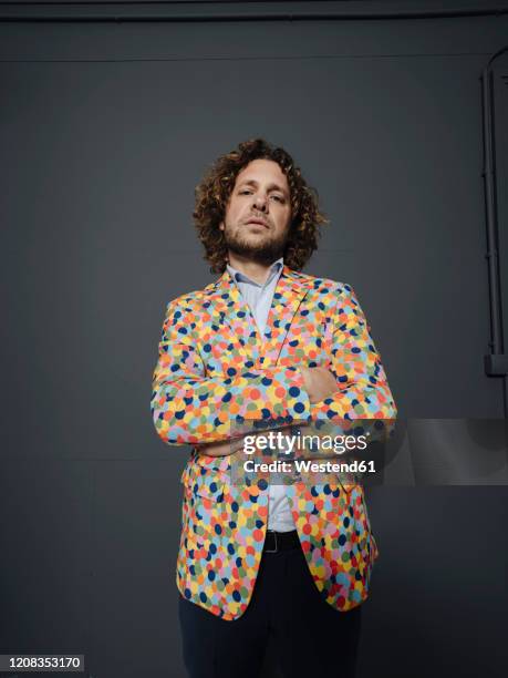 portrait of a businessman wearing colorful sports jacket - arrogance stock pictures, royalty-free photos & images