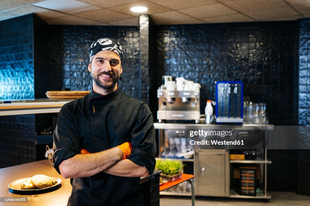 Portrait of smiling chef in restaurant kitchen