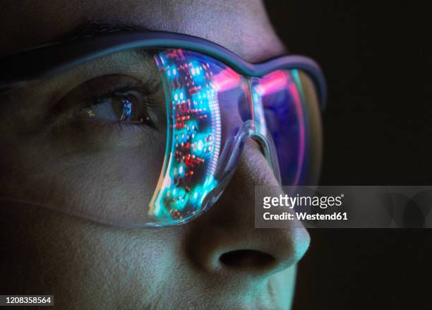 reflection of a circuit board on glasses - digitalisation stock pictures, royalty-free photos & images
