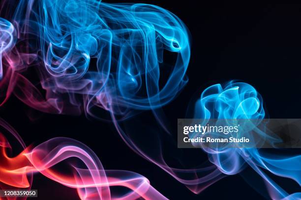 colorful steam on a black background. vaporizer smoke. abstract background. - electronic cigarette smoke stockfoto's en -beelden