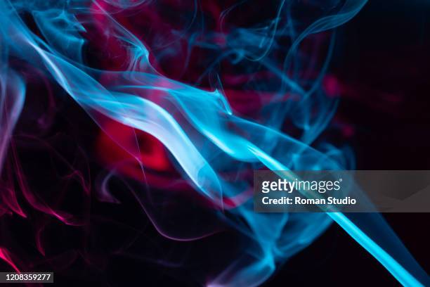 colorful steam on a black background. vaporizer smoke. abstract background. - vape cigarette stock pictures, royalty-free photos & images