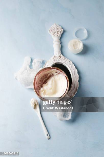 gauze, hand mirror and bowl of homemade shea butter moisturizer - shea butter stock pictures, royalty-free photos & images