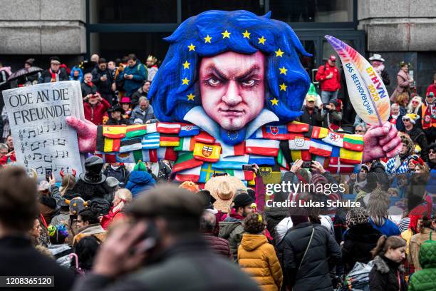 Float with an effigy depicting Ludwig van Beethoven makes its way past revellers during the Rose Monday carnival parade on February 24, 2020 in...