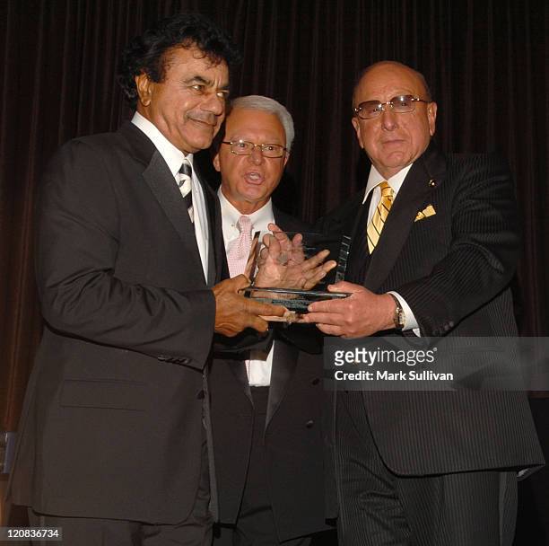 Johnny Mathis receives the 15th Annual Ella Award from Jerry F. Sharell and Clive Davis