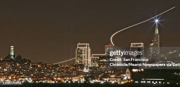 SKYLINEAIRPORT_022_fl.jpg The San Francisco skyline sparkles with holidays lights viewed from a fishing pier from Fort Baker Sausalito as airline...