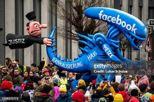 Float with an effigy depicting the relationship between judiciary and facebook makes its way past revellers during the Rose Monday carnival parade on...
