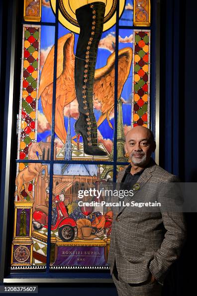 Designer Christian Louboutin poses during