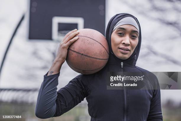 beautiful young female muslim basketball player - muslim rebel stock pictures, royalty-free photos & images