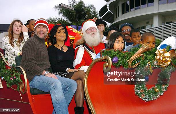 Scout Willis, Bruce Willis, Victoria Rowell, Santa and Samuel L. Jackson with children