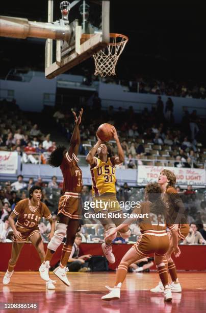 American basketball player Cheryl Miller of USC Trojans takes a shot during a match against the Texas Longhorns, at USC, Los Angeles, California,...