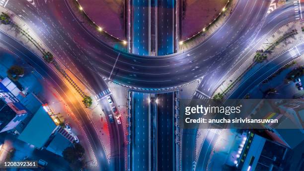 aerial top view of bangkok roundabout road at night, thailand. - città foto e immagini stock