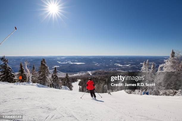 skiing at mont tremblant - mont tremblant ski village stock pictures, royalty-free photos & images