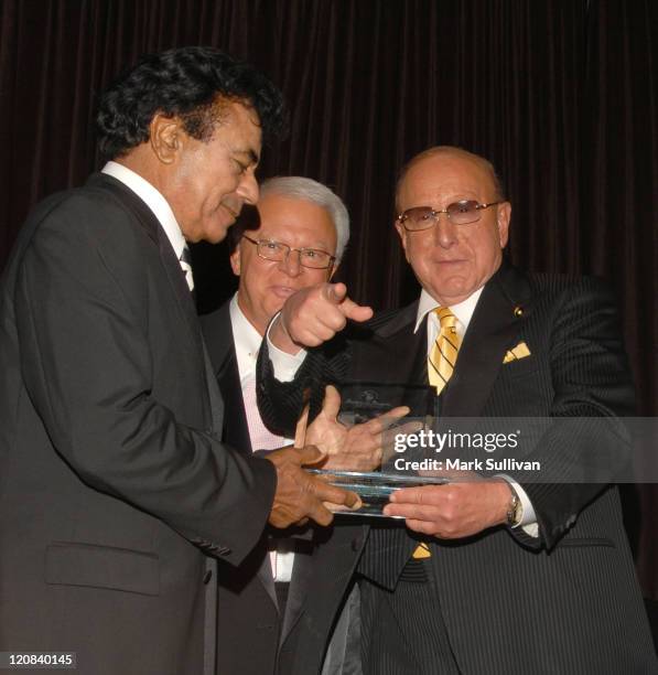 Johnny Mathis receives the 15th Annual Ella Award from Jerry F. Sharell and Clive Davis