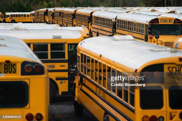 School buses sit parked at a lot in Marietta, Georgia, U.S., on Tuesday, March 24, 2020. As of Friday, Georgia had 1,643 confirmed COVID-19 cases,...