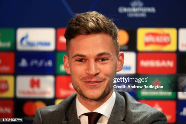 Joshua Kimmich of FC Bayern Munich speaks to the media during a FC Bayern Munich Press Conference ahead of their Champions League round of 16 match...