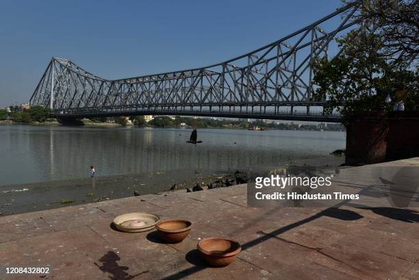 Deserted view of the iconic Howrah Bridge that spans the Hooghly River, on day 3 of the three-week nationwide lockdown to check the spread of...