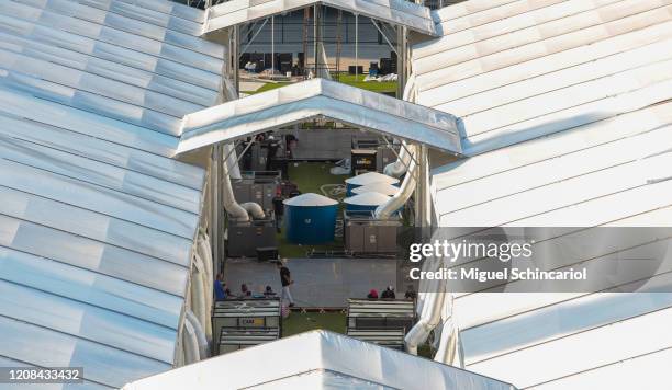 Workers set up an emergency makeshift field hospital at Pacaembu Stadium for coronavirus patients with a capacity of 200 beds on March 27, 2020 in...