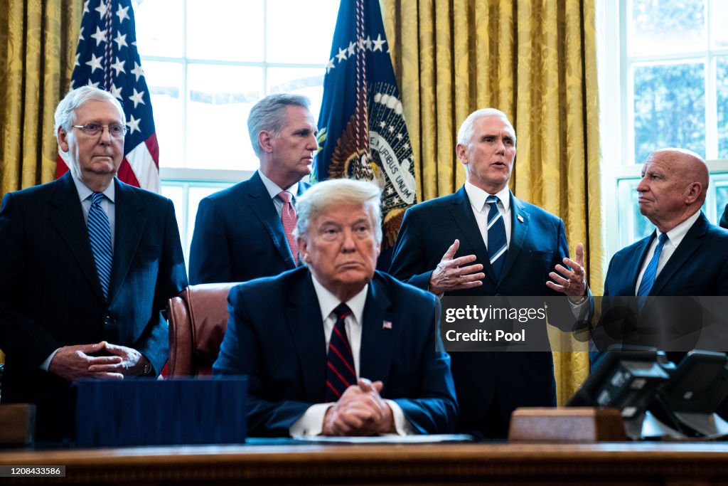 President Trump Signs Coronavirus Stimulus Bill In The Oval Office