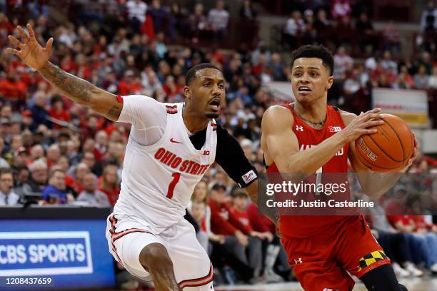 Anthony Cowan Jr. #1 of the Maryland Terrapins drives to the basket while being guarded by Luther Muhammad of the Ohio State Buckeyes at Value City...