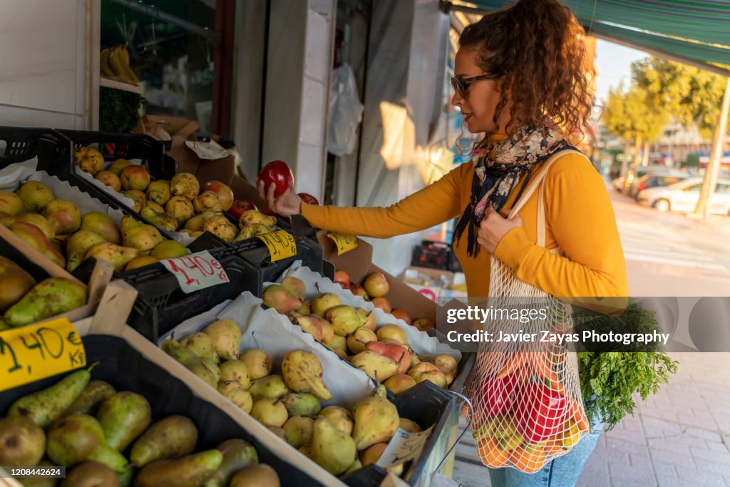 Young Woman Holding Reusable Cotton Mesh Bag