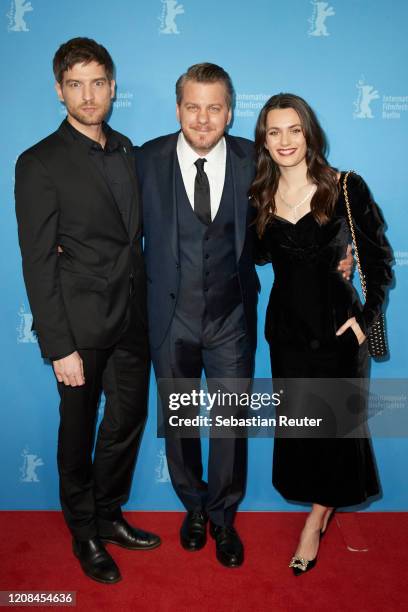 Robert Finster, showrunner Marvin Kren and Ella Rumpf pose at the Netflix premiere of "Freud" during the 70th Berlinale International Film Festival...