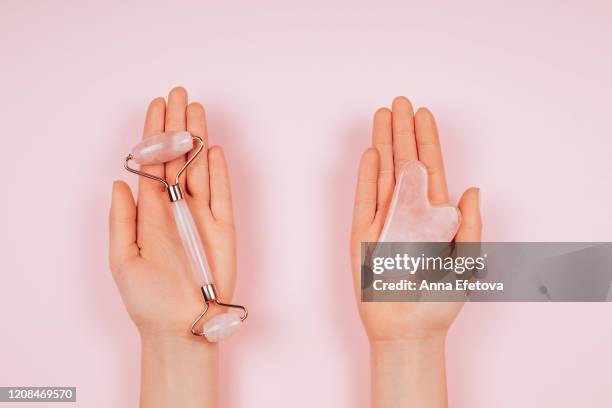 massagers in woman's hands - spooning stock pictures, royalty-free photos & images