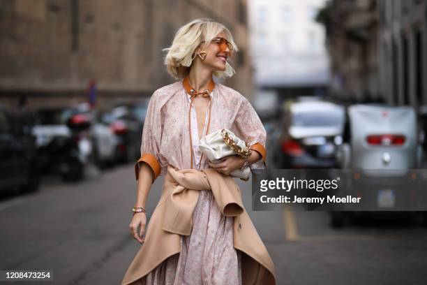 Viktoria Rader is seen wearing a Bottega Veneta bag and heels before Sportmax during Milan Fashion Week Fall/Winter 2020-2021 on February 21, 2020 in...