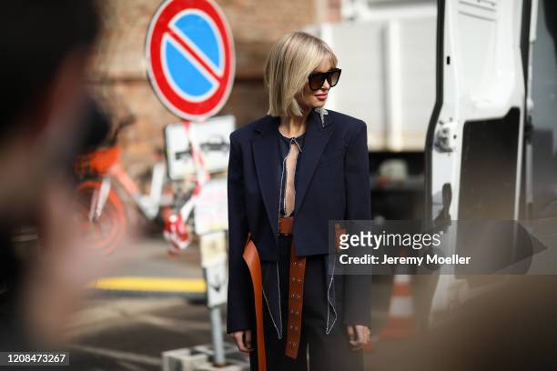 Xenia Adonts is seen wearing Bottega Veneta heels before Sportmax during Milan Fashion Week Fall/Winter 2020-2021 on February 21, 2020 in Milan,...