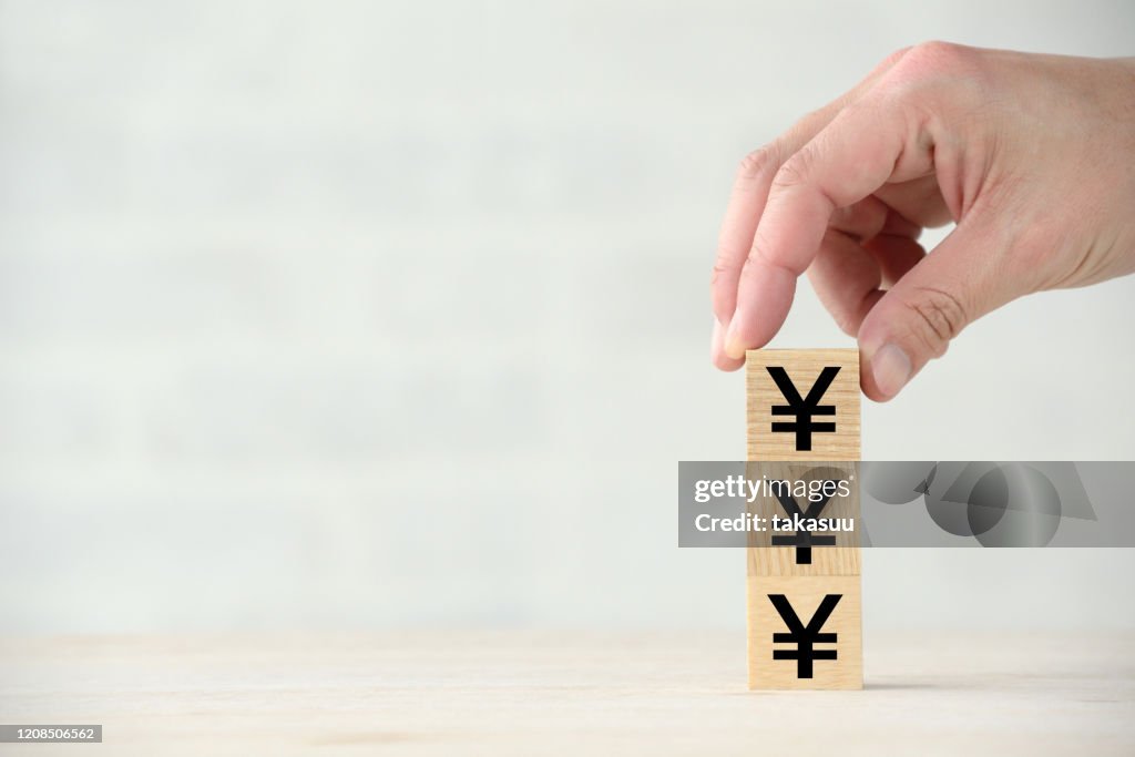 Increasing Japanese yen images with wooden blocks