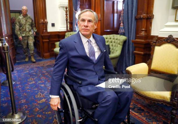 Texas Governor Greg Abbott arrives for his COVID-19 press conference at the Texas State Capitol in Austin. He announced the US Army Corps of...