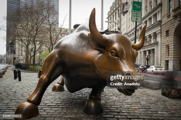 Charging Bull Statue is seen lonely at the Financial District in New York City, United States on March 29, 2020. New York is ranked as one of the...