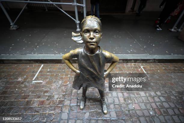 Fearless Girl Statue by the New York Stock Exchange building is seen at the Financial District in New York City, United States on March 29, 2020. New...