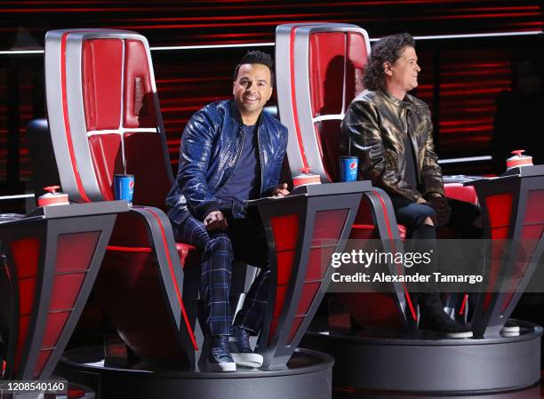 Luis Fonsi and Carlos Vives are seen on stage during Telemundo's "La Voz" Batallas Round 4 at Cisneros Studios on March 29, 2020 in Miami, Florida.