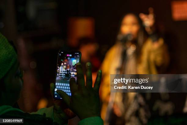 Tiffany Bennett works on the live social feed of musician and songwriter Tiffany Wilson while she performs during The Quarantine Sessions at the...