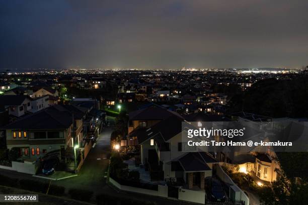 illuminated residential district in kanagawa prefecture of japan - stadsdeel stockfoto's en -beelden
