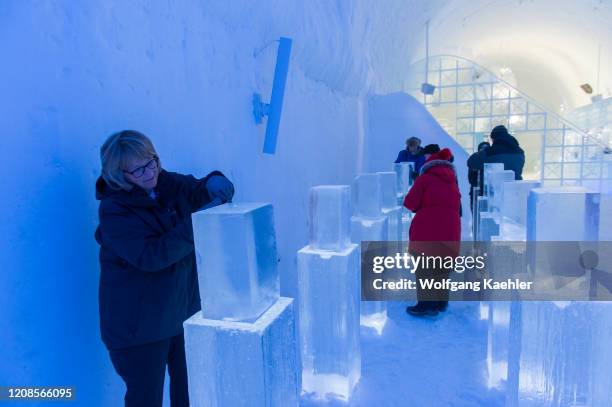 Tourists taking part in an ice sculpting class at the ICEHOTEL 365 which was launched in 2016 and is a permanent structure offering year round the...