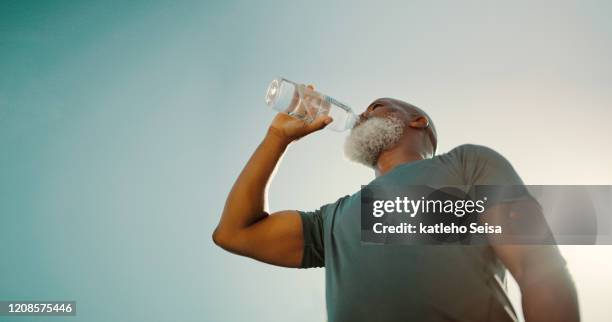 make sure you're hydrated after exercising - drinking water outside stock pictures, royalty-free photos & images